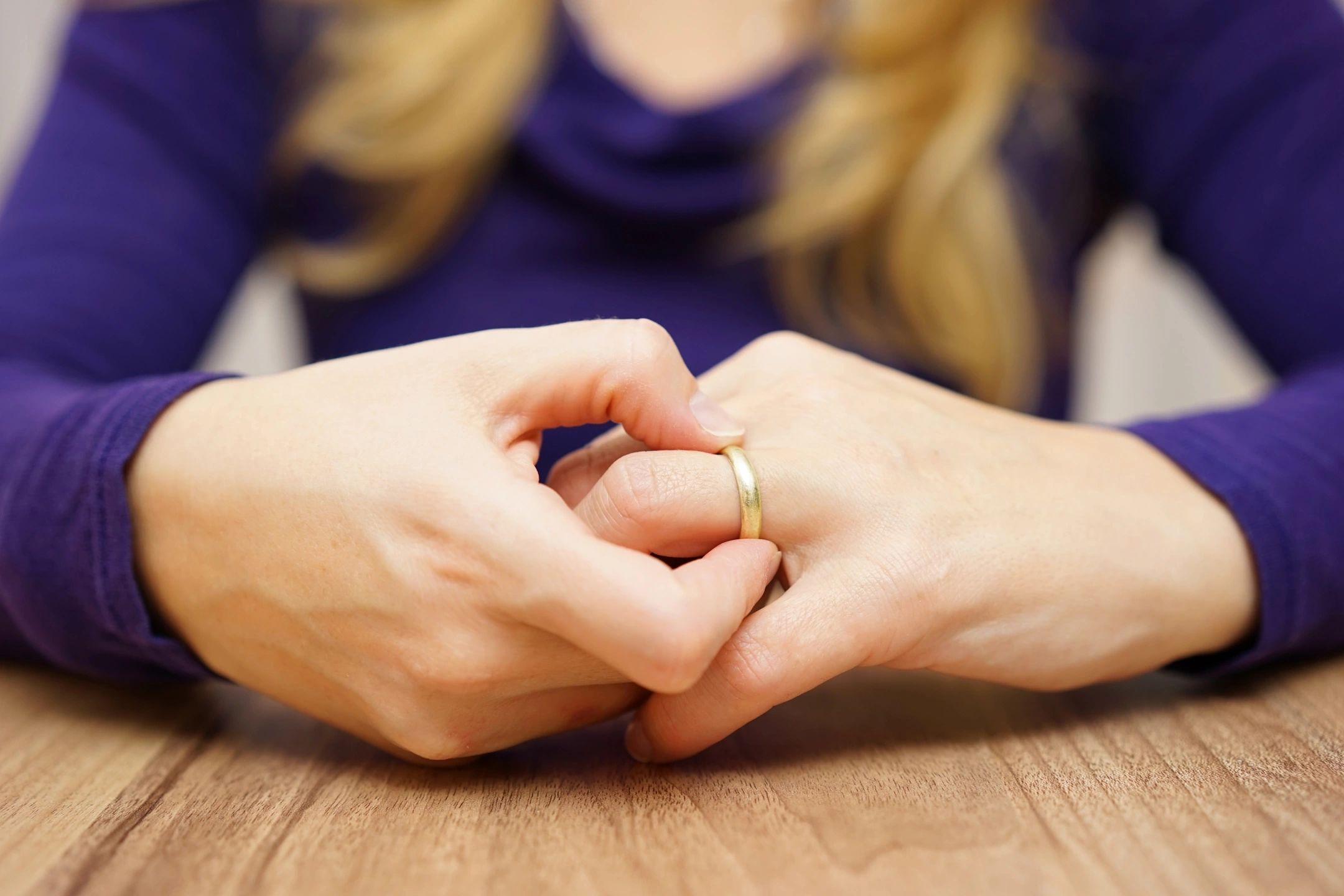 Woman ready to remove her wedding ring